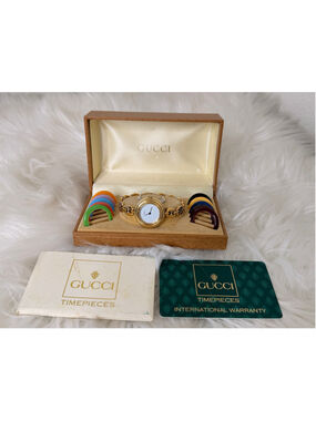 Gucci Interchangeable Bezel Horsebit link Watch, w/ 12 bezels, box & paperwork